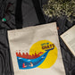 Tote bag with 'City of Ghats' design on a dark fabric background