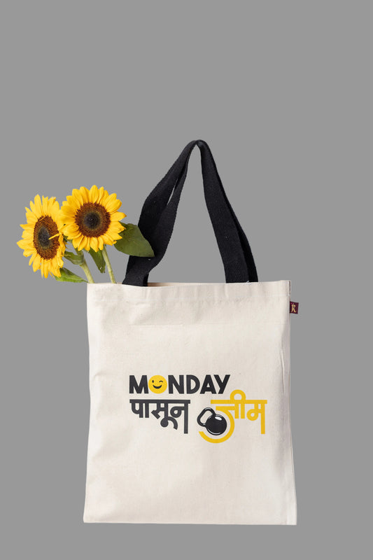 A white cotton tote bag with black handles and a graphic print that includes text and a kettlebell icon.