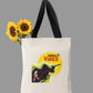 Tote bag with 'Jungle Vibes' design and sunflowers on a light gray background