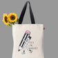 Tote bag with a design of a pencil and text on a light background