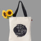 Tote bag with black text design 