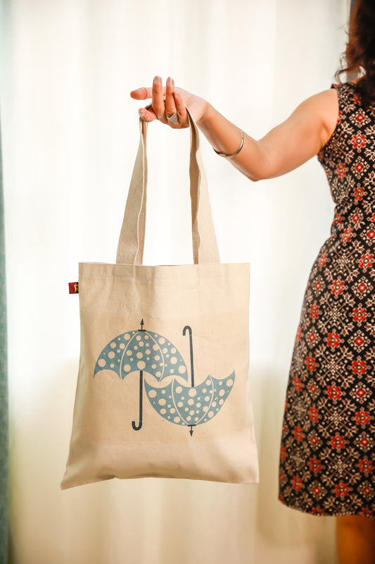 Quirky umbrella design on canvas tote bag