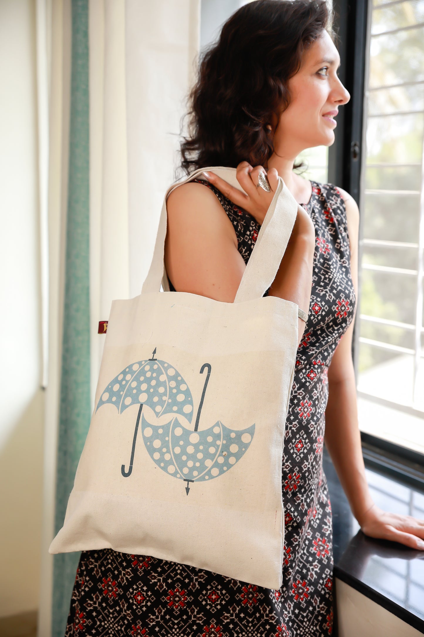 Quirky umbrela design on canvas tote bag